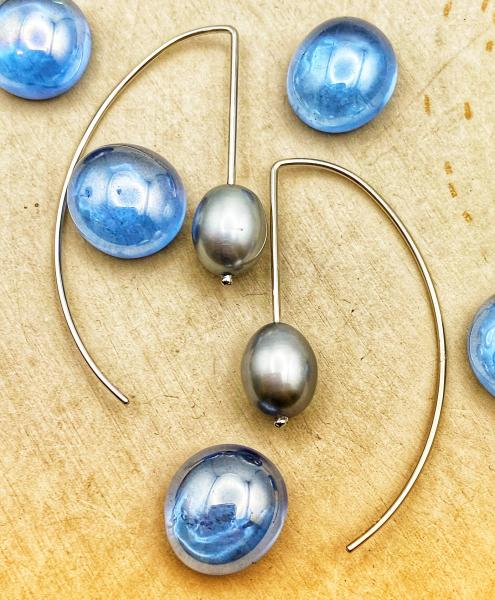 Sterling silver drop earrings with a gray oval freshwater  cultured pearl. $85.00