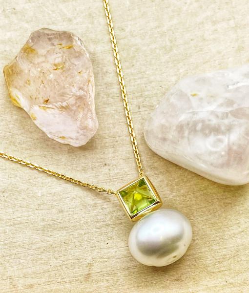 14 karat yellow gold 11mm oval South Sea cultured pearl and peridot necklace. $1039.00