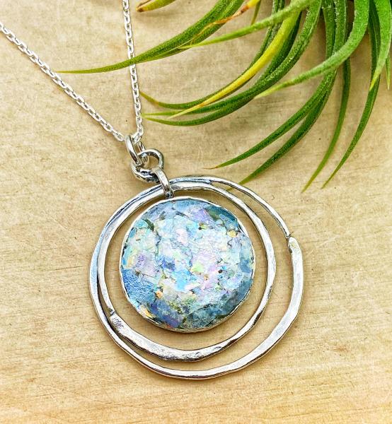 Sterling silver roman glass double circle pendant on 18" chain. $170.00 