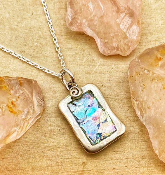 Sterling silver roman glass rectangle with swirl pendant on 18" chain. $120.00