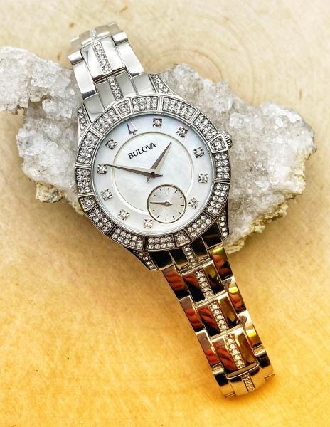 Ladies Bulova stainless steel watch, mother of pearl face, crystal accents. $395.00