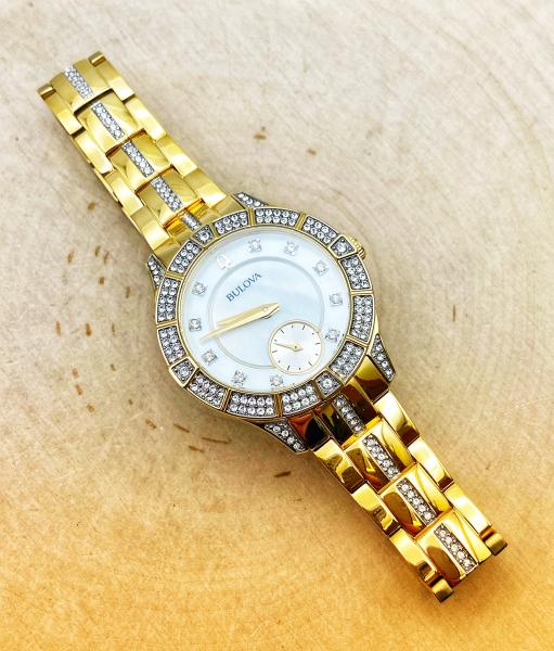 Ladies Bulova stainless steel two tone yellow gold watch, mother of pearl face, crystal accents.$395.00