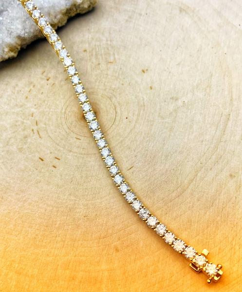 14 karat yellow gold 5.00ctw lab grown VS/EF diamond 7" tennis bracelet. $5000.00
