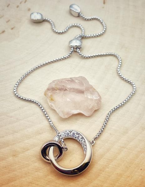 Sterling silver beveled circle and cubic zirconia adjustable bracelet. $205.00