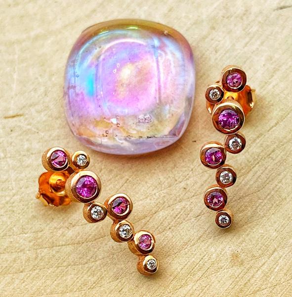 14 karat rose gold purple garnet and diamond earrings. $1420.00