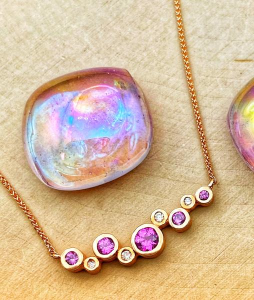 14 karat rose gold purple garnet and diamond necklace. $1420.00