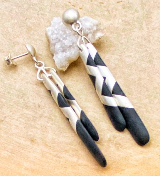 Sterling silver and matte black resin "tubular bells" earrings. $390.00