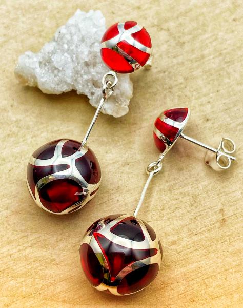 Sterling silver red resin ball earrings. $285.00