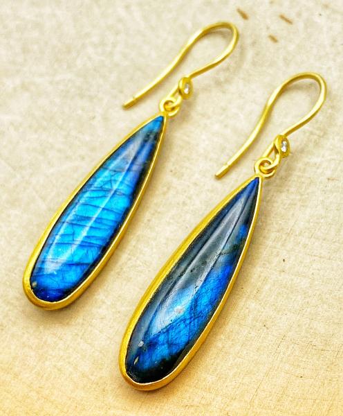 24 karat yellow gold earrings with pear shaped labradorite backed with black onyx. $1670.00