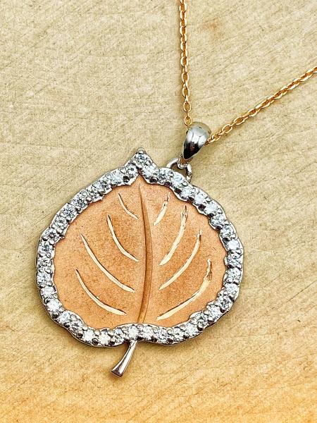 14 karat rose and white gold diamond Aspen leaf. $1600.00