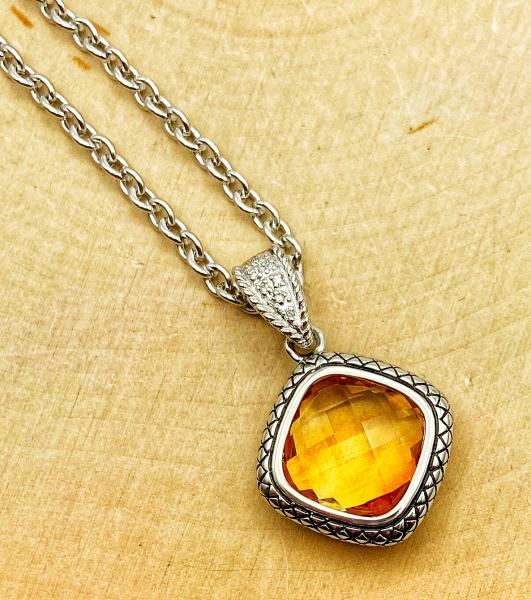 Sterling silver checkerboard cut citrine and diamond necklace. $450.00