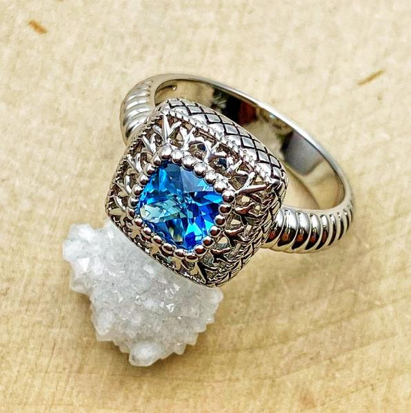 Sterling silver checkerboard cut Swiss blue topaz ring. $150.00