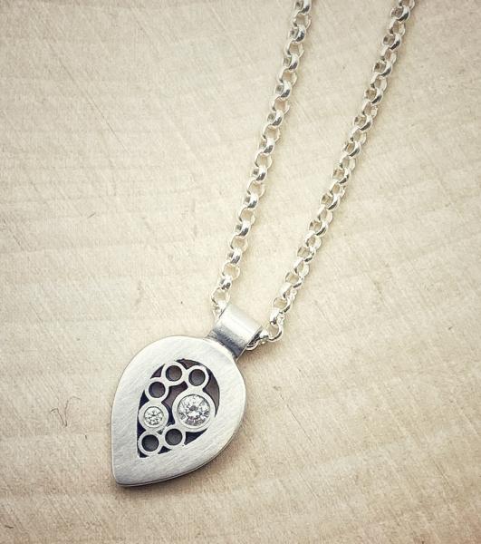 Sterling silver and diamond tear drop necklace. $340.00