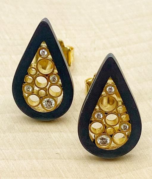 18 karat gold and oxidized silver diamond tear drop stud earrings. $1250.00