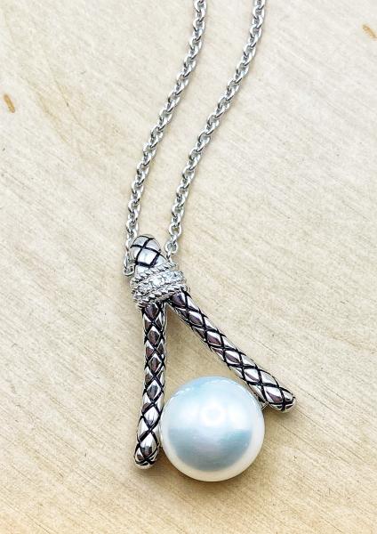Sterling silver necklace with a 10mm freshwater cultured pearl and diamond accents. $325.00