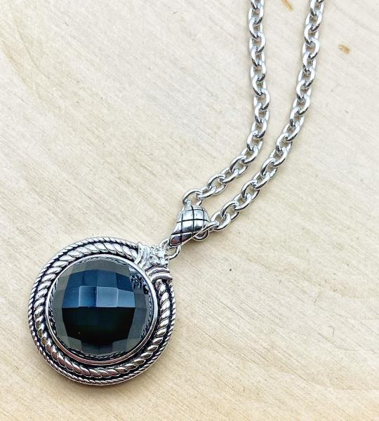 Sterling silver necklace with a 12mm rose cut black onyx and diamond accents. $375.00
