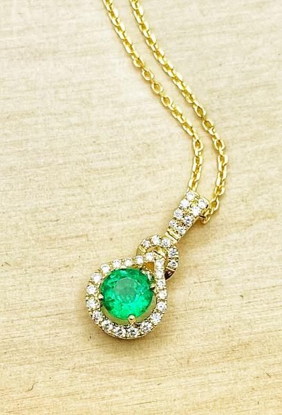 14 karat yellow gold emerald and diamond necklace. $2945.00