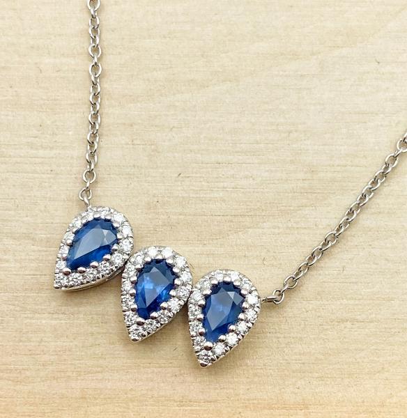 14 karat white gold blue sapphire and diamond necklace. $1890.00