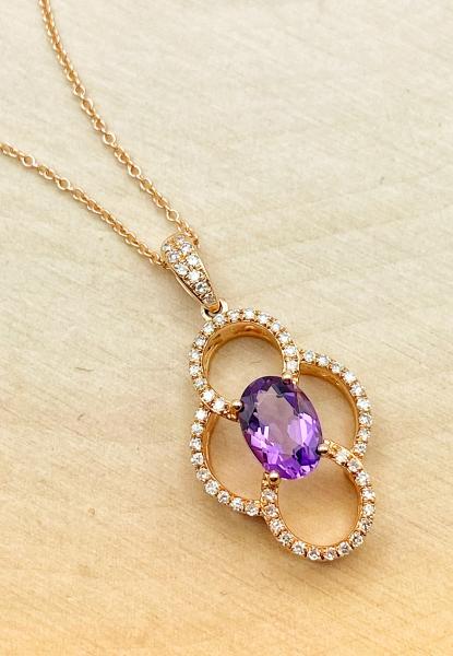 14 karat rose gold amethyst and diamond necklace. $975.00