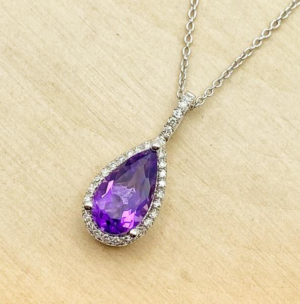 14 karat white gold pear shape amethyst and diamond necklace. $750.00