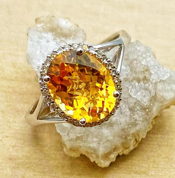 14 karat white gold checkerboard cut citrine and diamond ring. $900.00