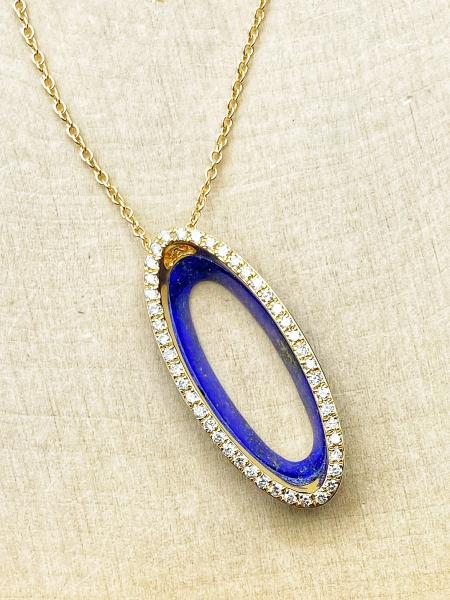 14 karat yellow gold diamond and lapis lazuli necklace. $1,380.00