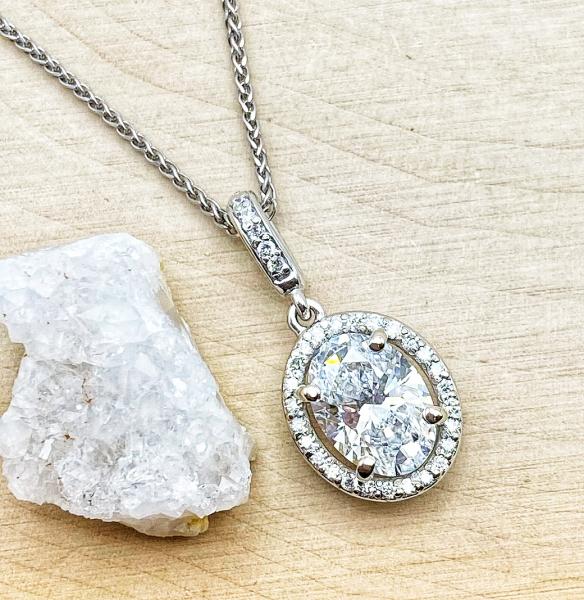 14 karat white gold lab grown diamond halo pendant totaling 1.73 carats. $4250.00