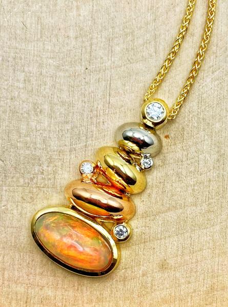 18 karat yellow, rose and white gold 4.50 carat Ethiopian opal and diamond necklace. $3350.00 **SOLD**