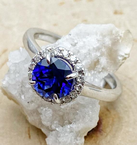 14 karat white gold laboratory grown blue sapphire and diamond ring. $1575.00