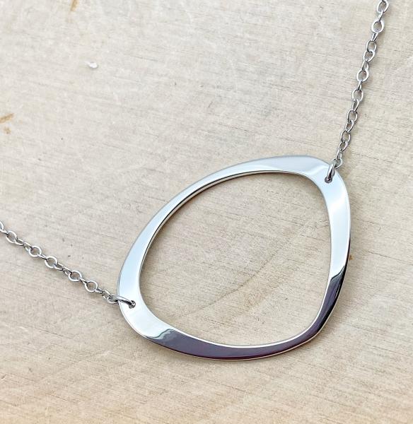 Sterling silver free-form "O" necklace. $80.00
