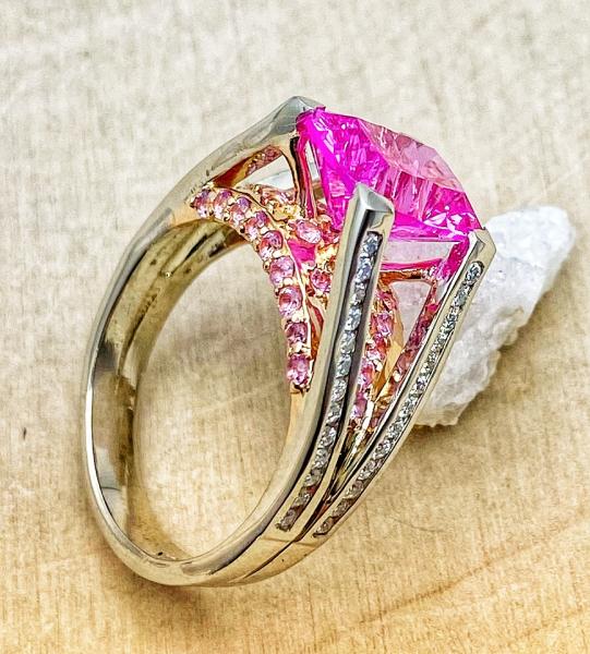 Profile view of lab pink sapphire ring.