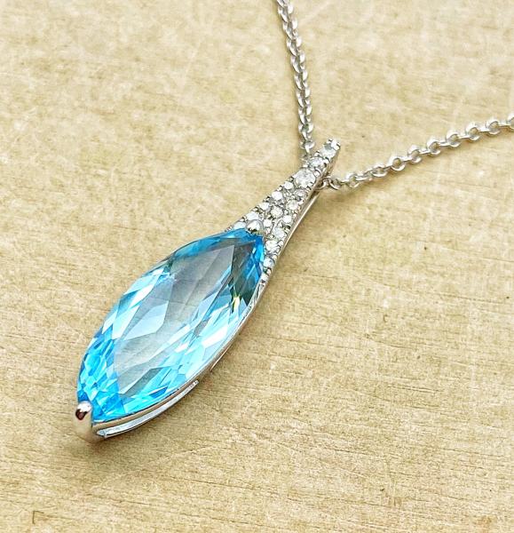 14 karat white gold necklace with a 3.55 carat marquise cut blue topaz and diamonds. $1175.00