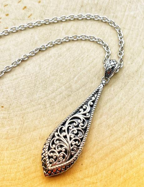 Sterling silver filigree tear drop necklace. $325.00