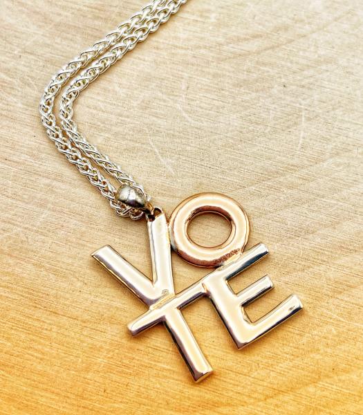 Sterling silver and 18 karat rose gold vermeil VOTE necklace. $195.00