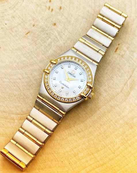 18 karat yellow gold and stainless steel ladies Omega Constellation circa 1990's. $1995.00