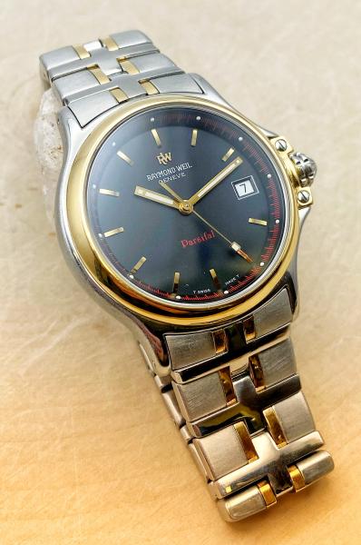 Stainless steel and 18 karat gold electroplate Raymond Weil Parsifal 9090. $500.00
