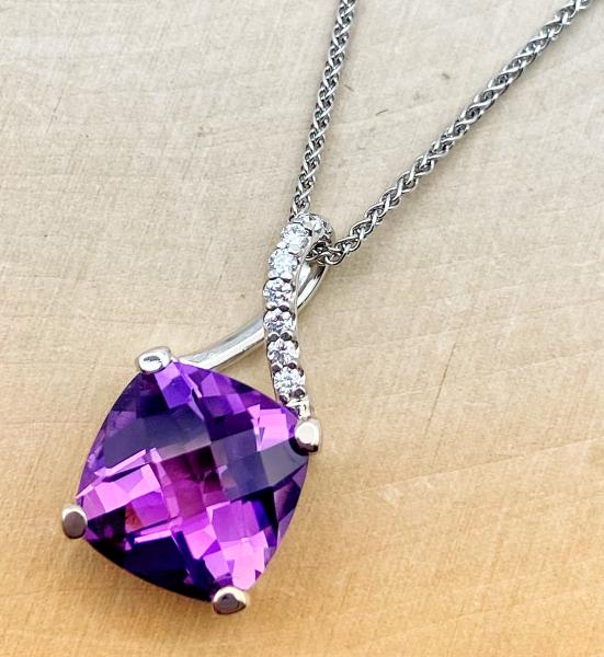 14 karat white gold checkerboard cushion cut amethyst and diamond necklace. $1400.00