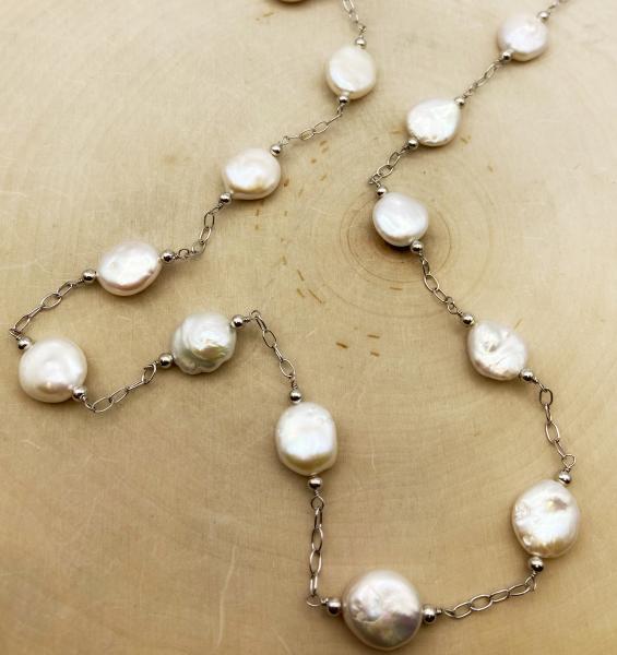 Sterling silver, 38" Freshwater cultured coin pearl station necklace. $300.00