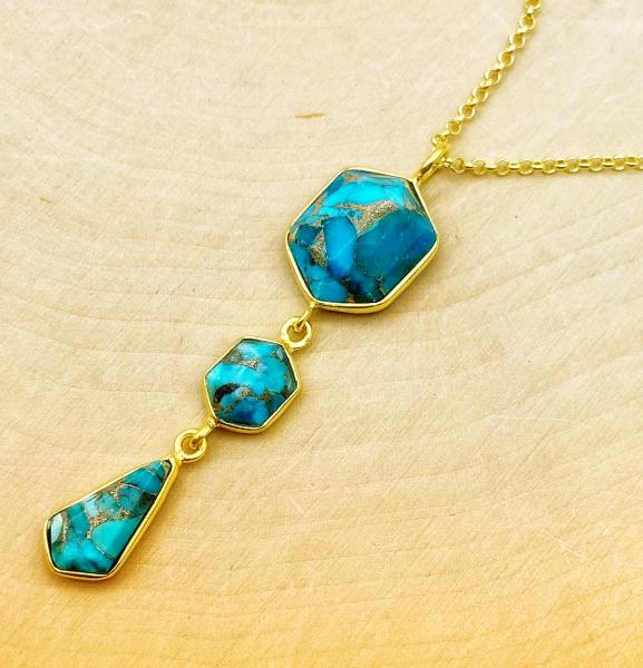 Sterling silver and 18 karat gold vermeil fancy cut turquoise drop necklace. $240.00