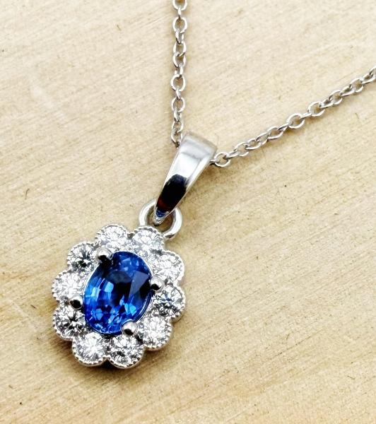 14 karat white gold sapphire and diamond necklace. $2064.00