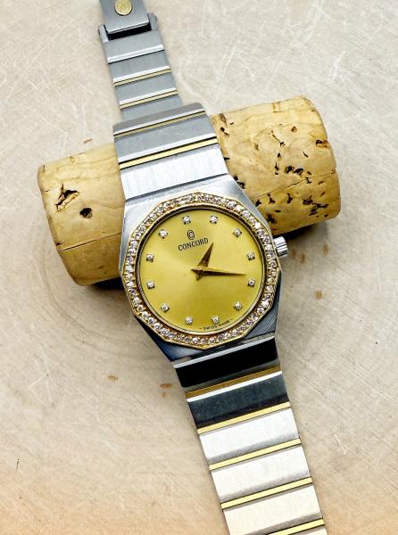 Ladies Concord with 18 karat gold diamond bezel. Circa 1980's. $1495.00