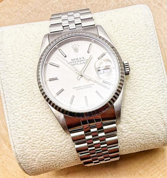 Gents stainless steel Rolex Oyster Perpetual Datejust with 18 karat white gold fluted bezel. Circa 2010. $9150.00