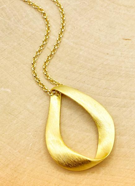 Sterling silver and 18 karat gold vermeil "love" pendant. $150.00