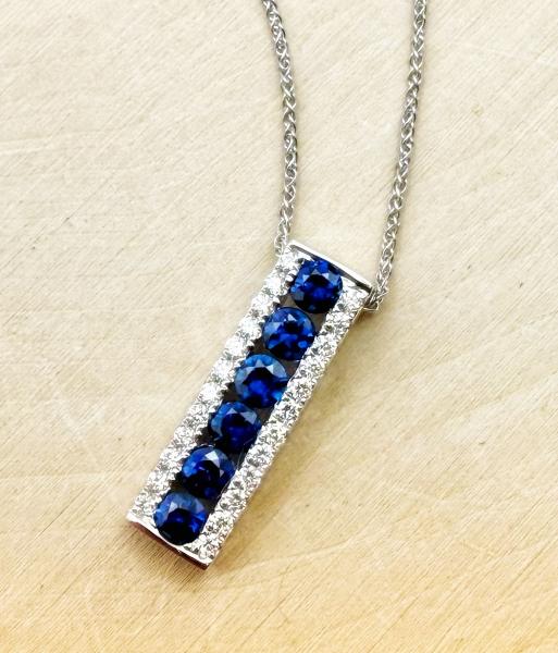 14 karat white gold blue sapphire and diamond necklace. $2,360.00