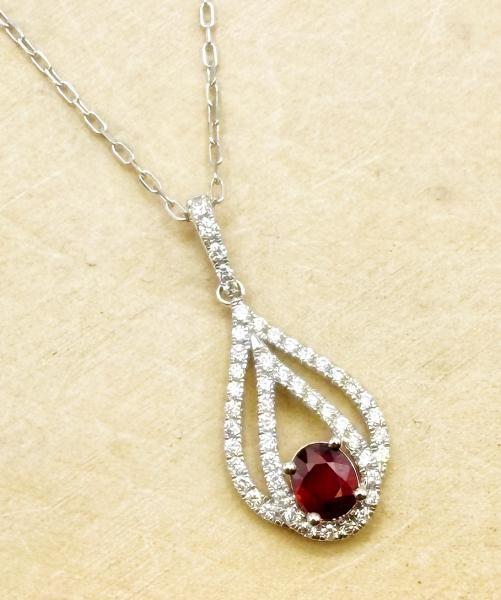 14 karat white gold tear drop design ruby and diamond necklace. $2210.00