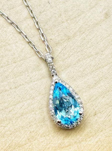 14 karat white gold 1.17 carat pear shape Swiss blue topaz and diamond necklace. $1075.00