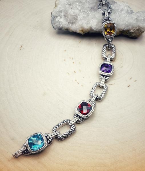 Sterling silver topaz. garnet, amethyst, citrine and yellow quartz bracelet. $775.00