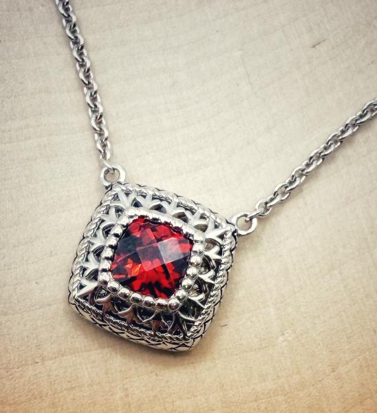 Sterling silver checkerboard cut garnet necklace. $250.00