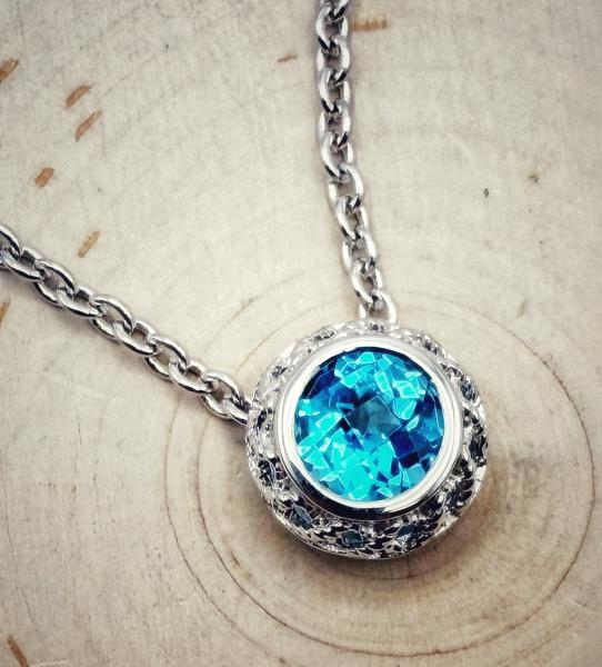 Sterling silver round checkerboard cut blue topaz necklace. $225.00