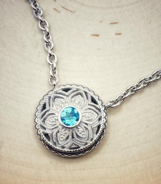 Sterling silver blue topaz and diamond filigree necklace. $525.00